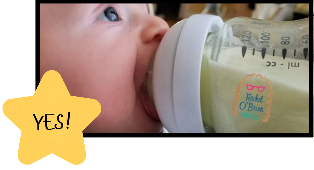 A baby drinking from a bottle

Description automatically generated